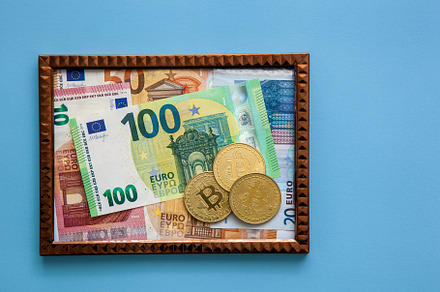 Euro and Bitcoin banknotes in a frame, a Business Photo by Photostock
