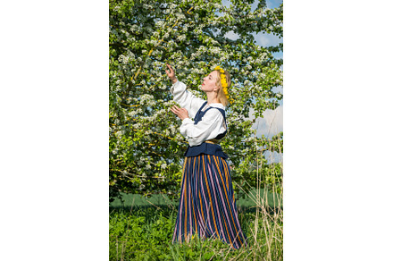 Beautiful feminime woman in national, a Holiday Photo by COLORFUL