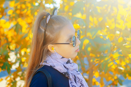 girl in glasses on an autumn sunny day, a Person Photo by vimart