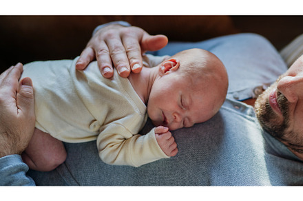 Close-up of father cudddling his, a Person Photo by HalfPoint