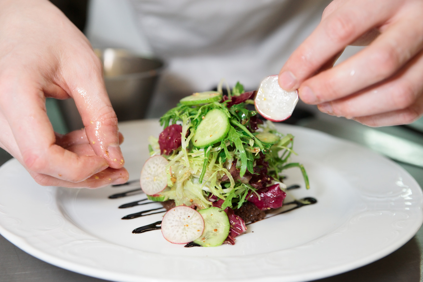 Chef is decorating appetizer featuring appetizer, chef, and closeup, a ...