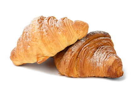 two baked croissants on a white isolated background, dessert for, a Food & Drink Photo by ndanko