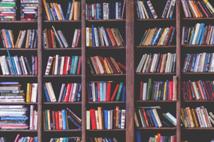 Toned image of colorful books in shelves, a School & Education Photo by Super duper stock images 