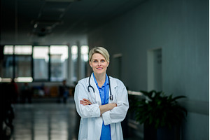 Young female doctor with short hair, a Person Photo by HalfPoint