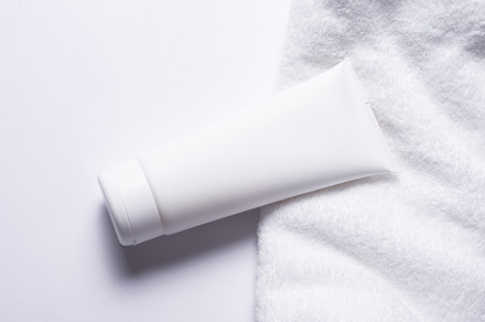 White plastic tube for cosmetic with terry towel, minimalistic c