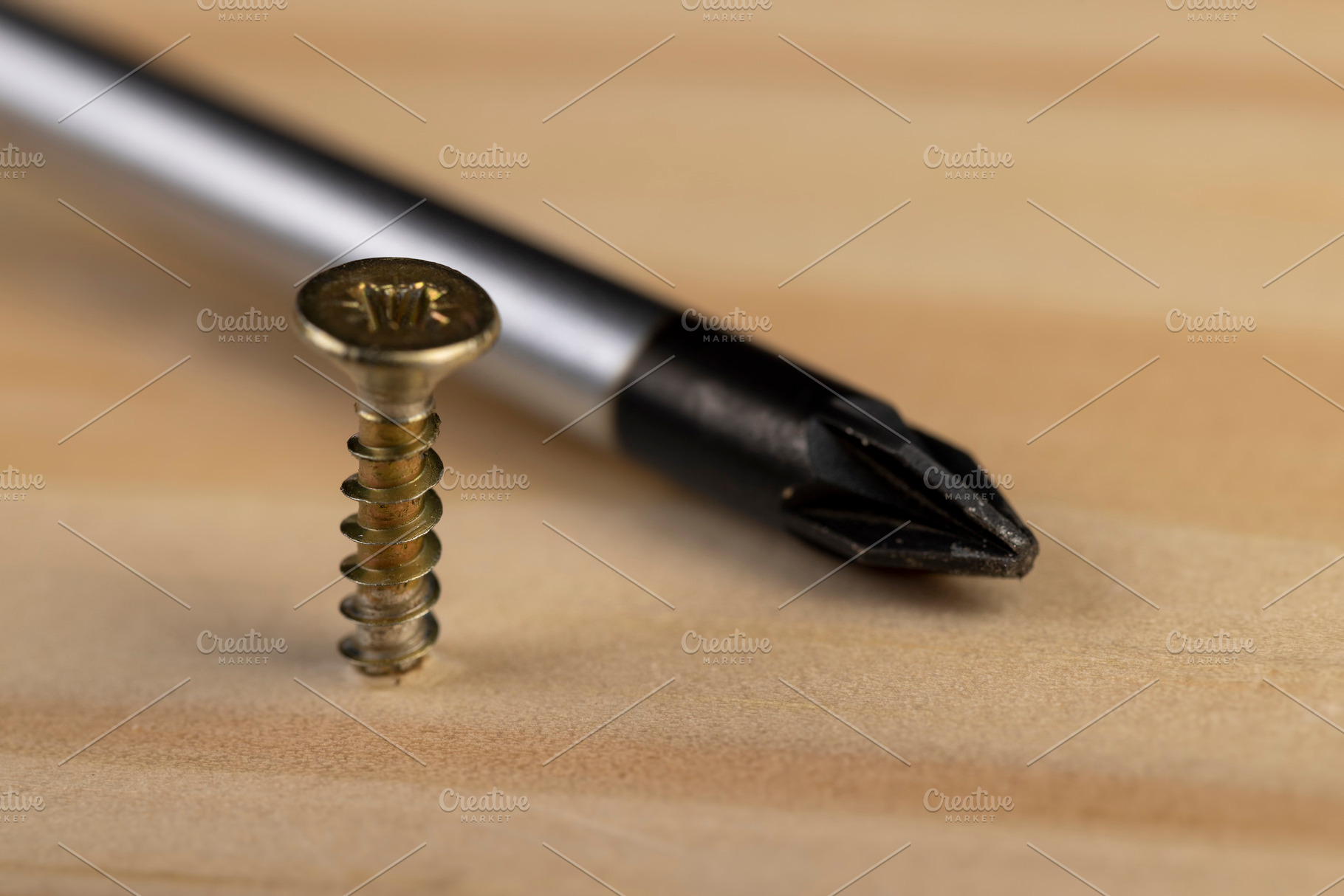yellow metal self tapping screws for fastening are used in construction, a Photo by rsoollAI