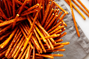 Organic Salty Pretzel Sticks in a Bowl, top view. Close-up., a Food & Drink Photo by LiudmylaChuhunova