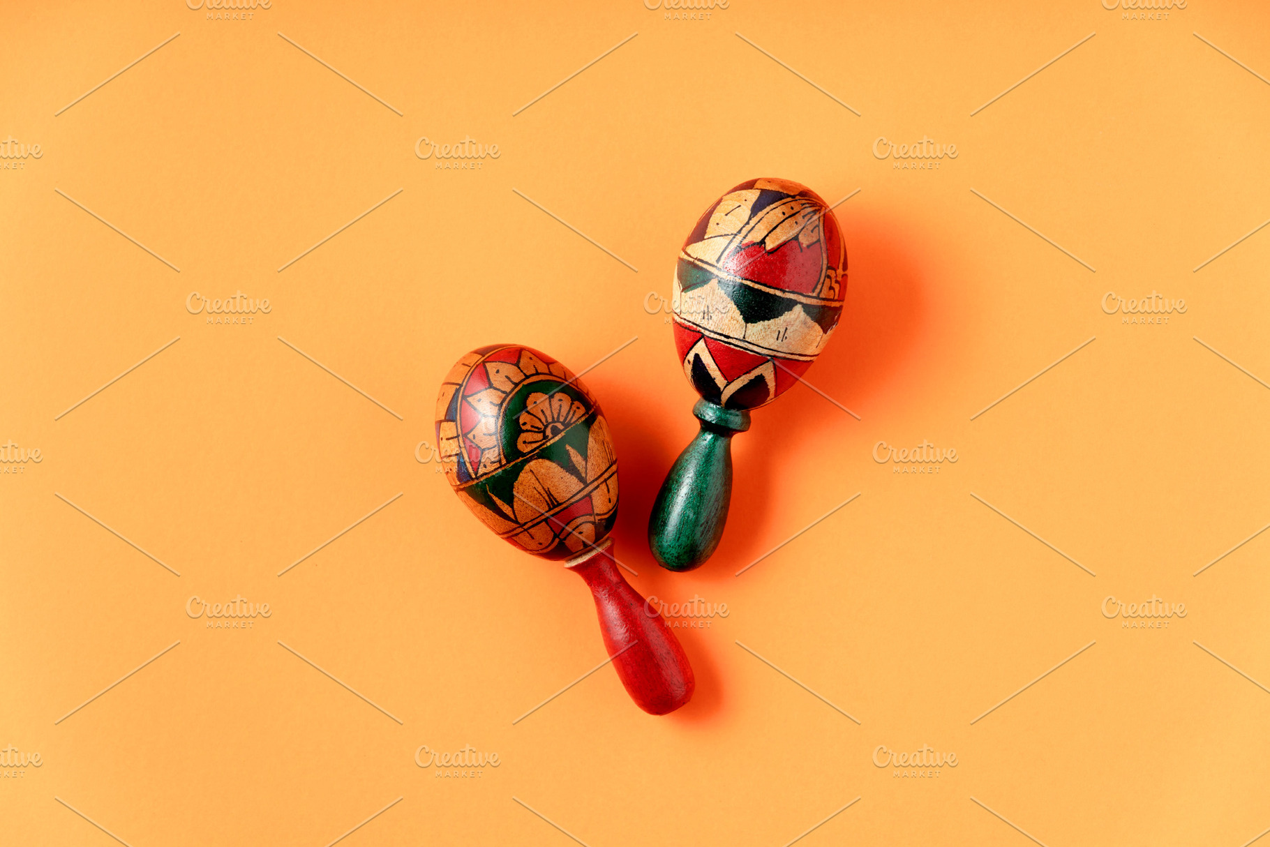 Couple of maracas on vibrant yellow background top view, an Arts & Entertainment Photo by Natalia Klenova's Shop
