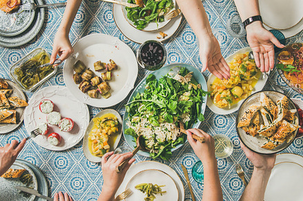 Flatlay of hands holding featuring mediterranean, people, and food, a Food & Drink Photo by Foxys