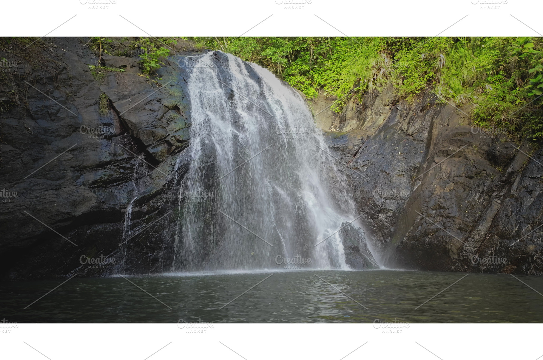 Waterfall rushing down dark rock, a Nature Photo by Goinyk