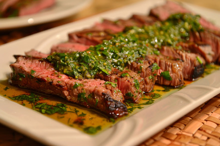 A flat iron steak topped with pesto, a Photo by Iftikhar Alam