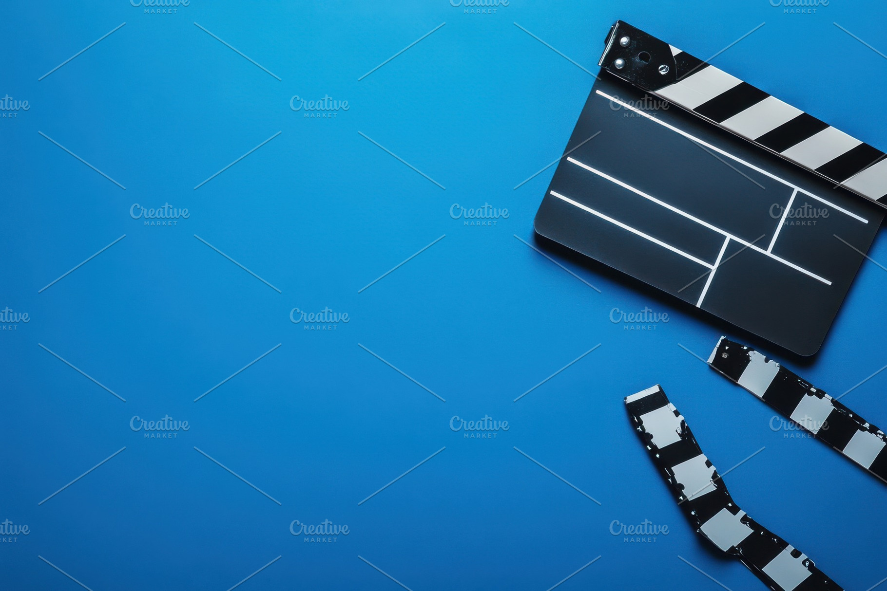 Movie clapperboard positioned on a b, a Photo by Iftikhar Alam