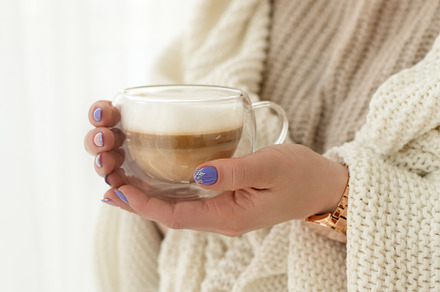 woman with a cup of hot drink