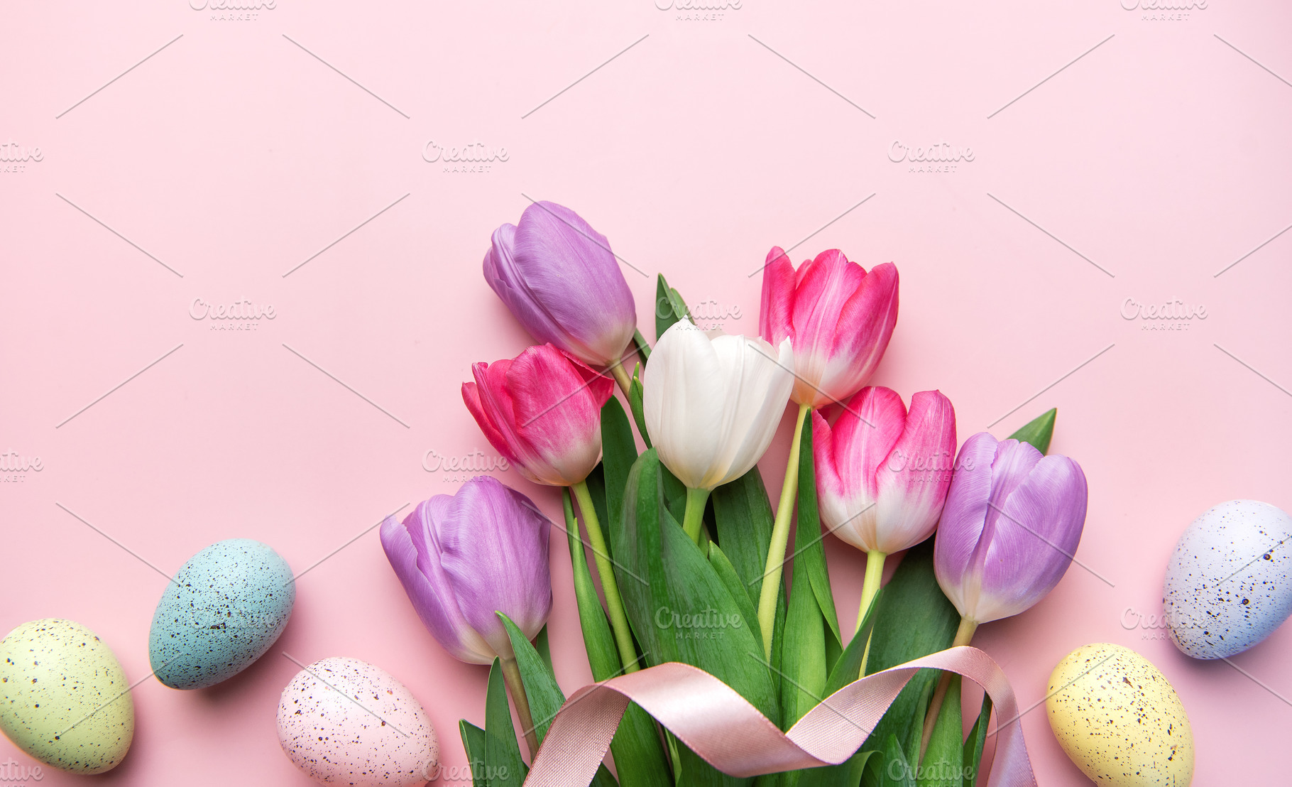 Colorful tulips and speckled eggs celebrating spring easter holi, a Holiday Photo by Olena Rudo