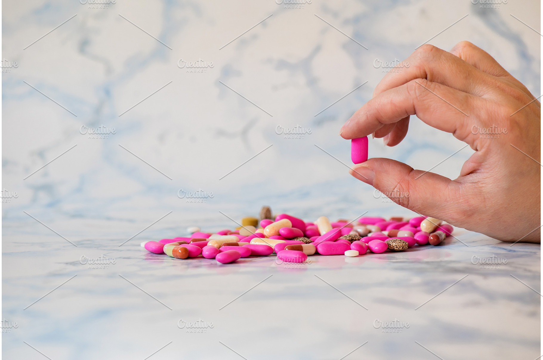 Shot of tablet in the fingers of, a Health & Medical Photo by Beautiful things