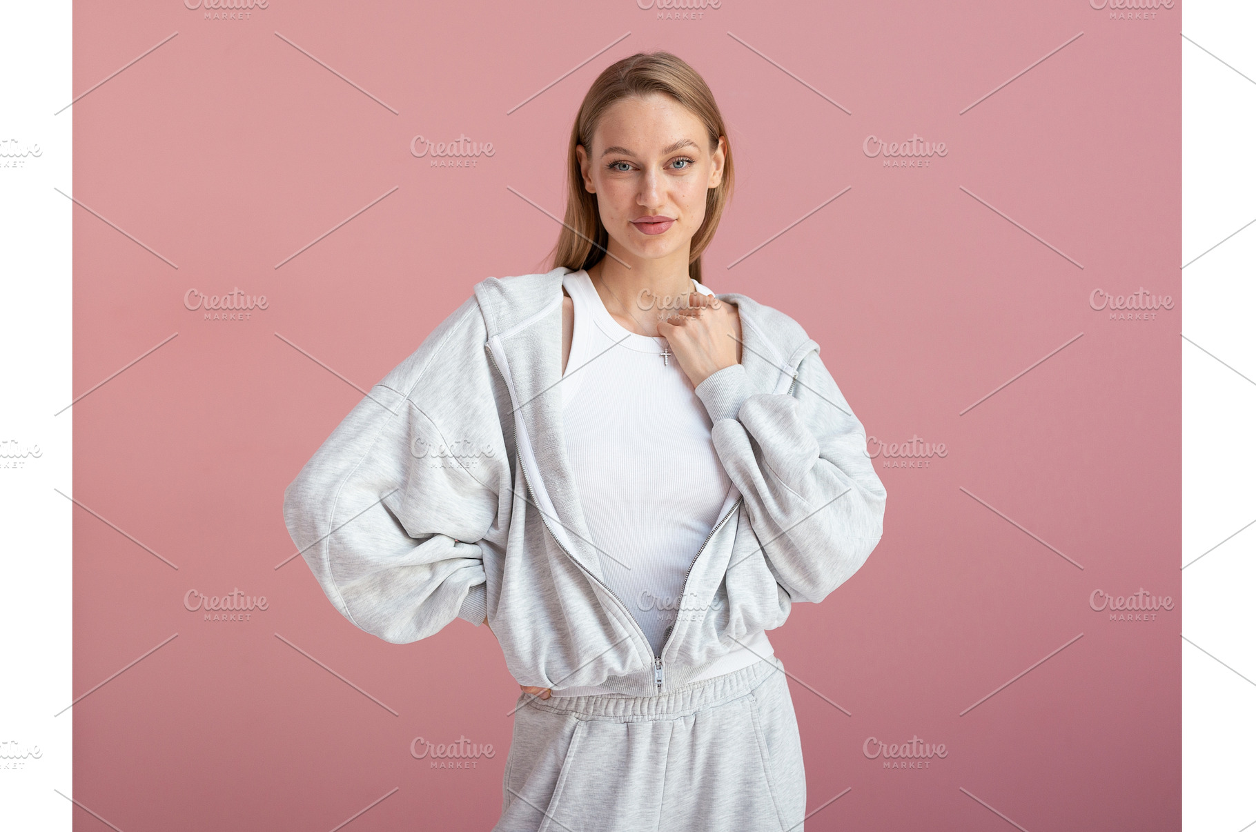 Woman in gray outfit standing still, a Person Photo by undrey
