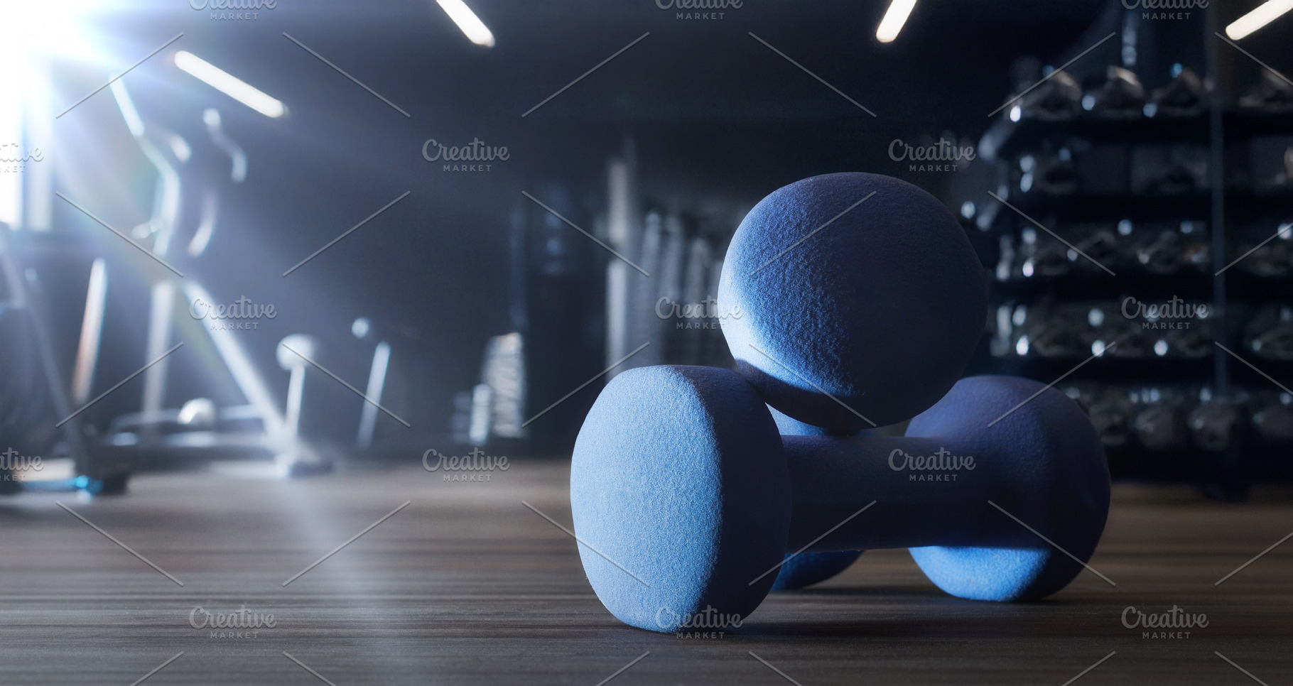 Sport training with dumbbell on wooden floor and gym background, a Sports & Recreation Photo by Davizro's Market