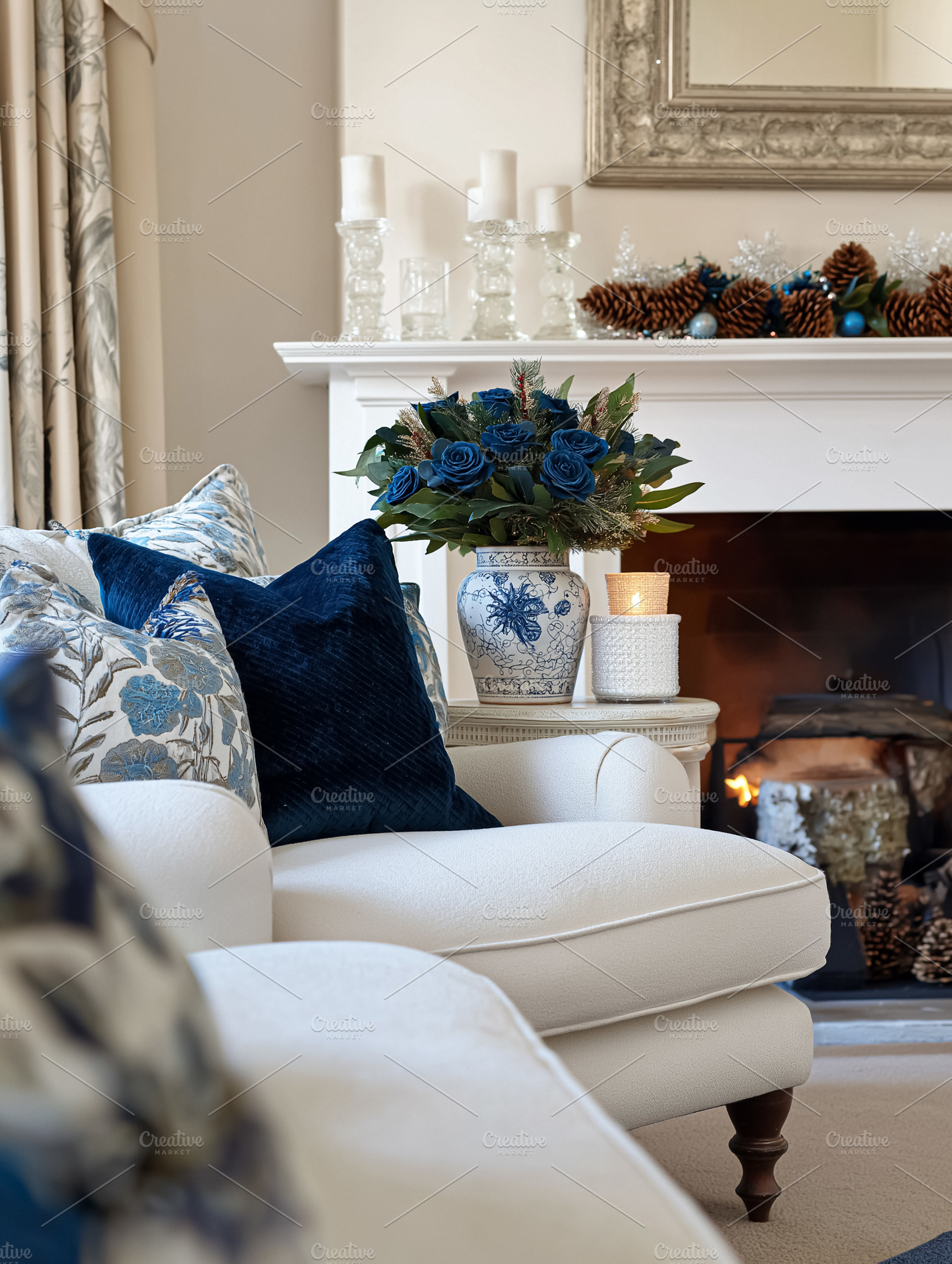 Cozy living room interior with burning fireplace, decorative blue roses, festiv, a Holiday Photo by Studio ANNA