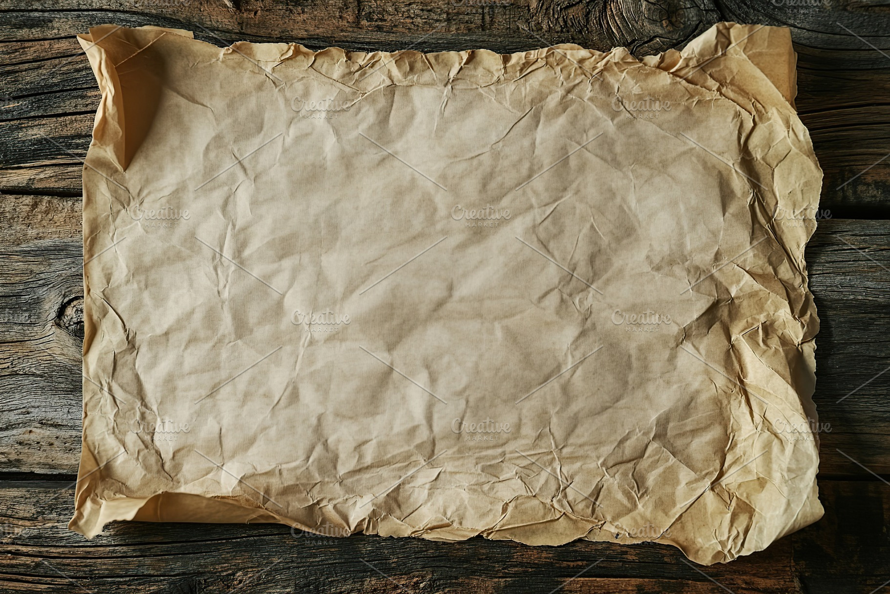 Wrinkled sheet of paper on wooden table, a Background Photo by AlyaAnd