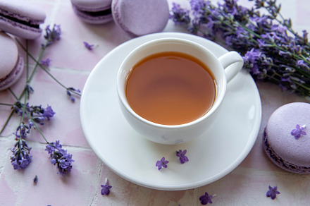 Cup of tea with macaroon dessert with lavender flavor, a Food & Drink Photo by Olena Rudo