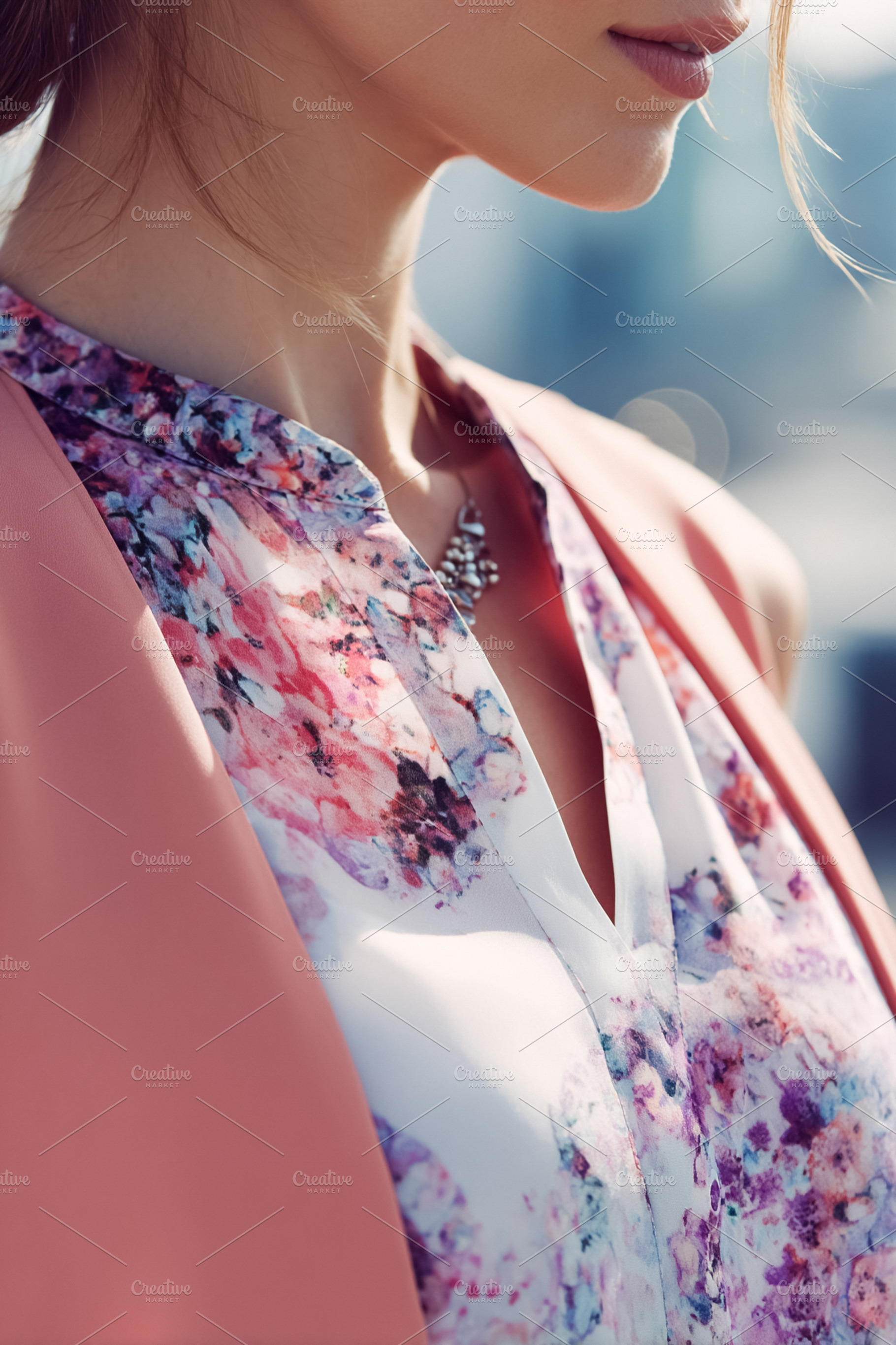 Woman wearing a stylish floral blouse and peach cardigan, showca, a Photo by Studio ANNA