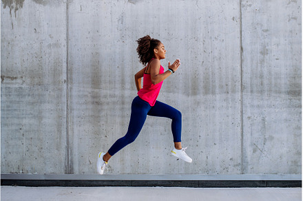 Young multiracial girl jogging and, a Sports & Recreation Photo by HalfPoint