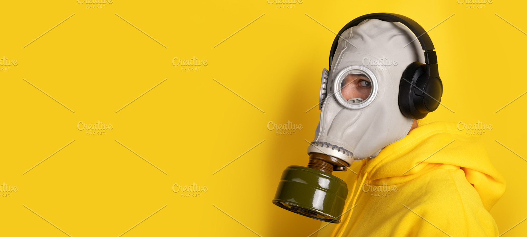 Close-up of person wearing a gas mask and black headphones, dres, a Person Photo by Ales Munt