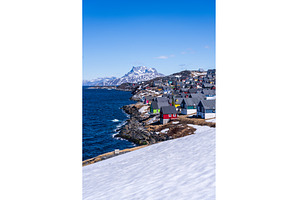 Colorful homes along coastline of, an Architecture Photo by Backyard Stock