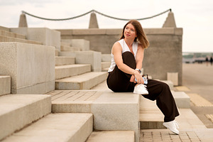 Young woman sitting on steps, a Person Photo by Elena Vagengeim