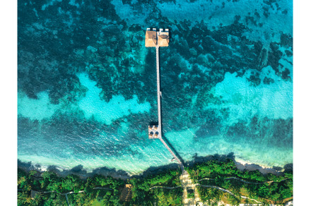 Aerial view of bungalow, white sandy, a Nature Photo by den-belitsky
