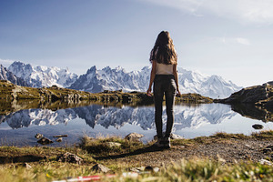 Girl on a lake in the alps containing mountain, view, and hike