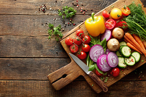 Fresh vegetables on a wooden cutting board, a Food & Drink Photo by AlyaAnd