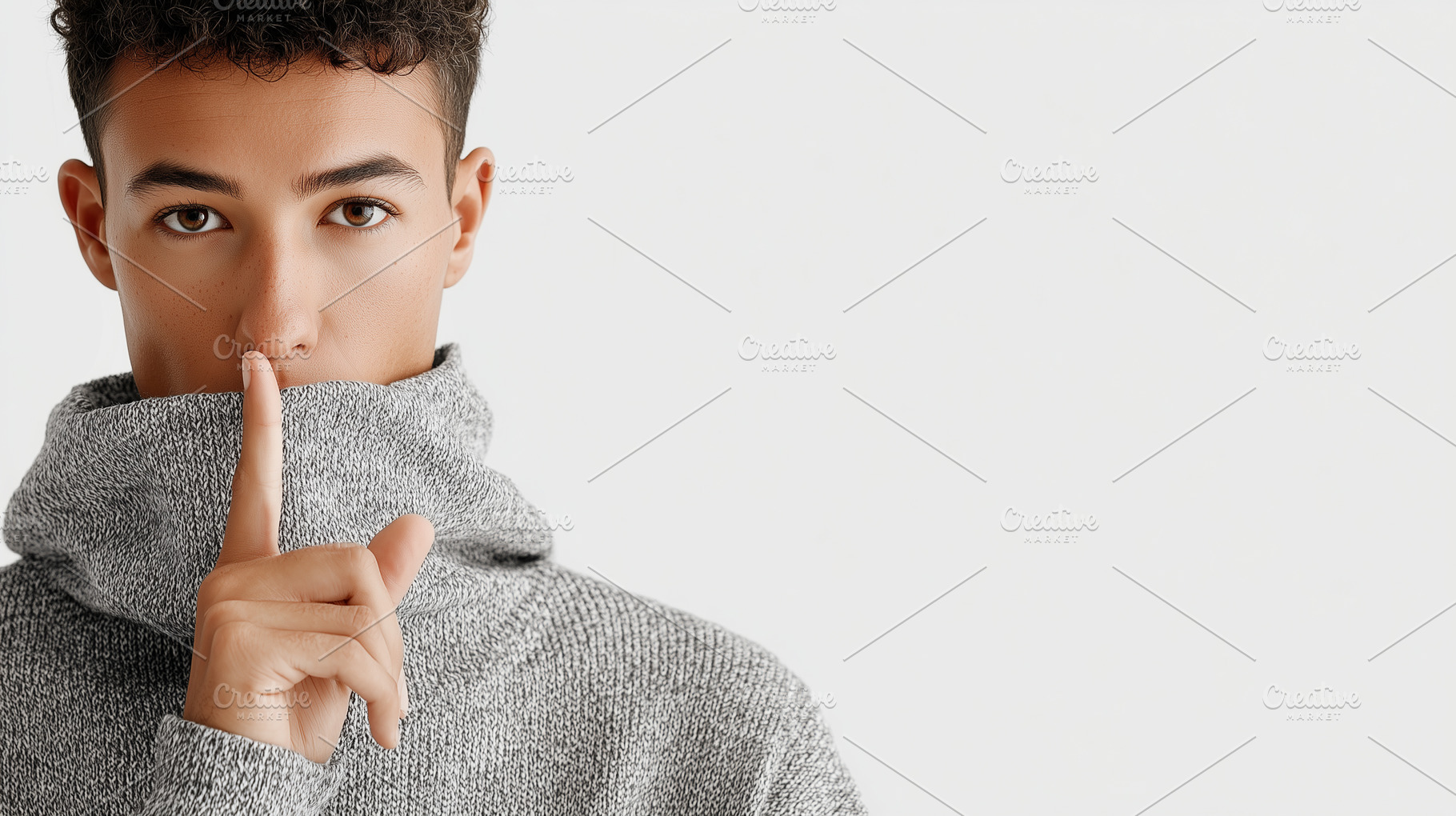 Young man in a gray sweater making, a Person Photo by MistyDay
