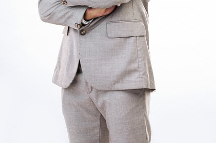 Serious, business man and portrait of arms crossed in studio, white background and leadership. Focused male model, entrepreneur and professional corporate worker with pride, power and suit of boss, a Photo by Peopleimages.com