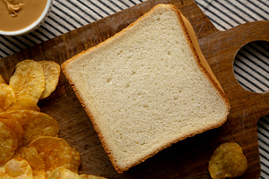Homemade American Peanut Butter Sandwich on a Wooden Board, top, a Food & Drink Photo by LiudmylaChuhunova