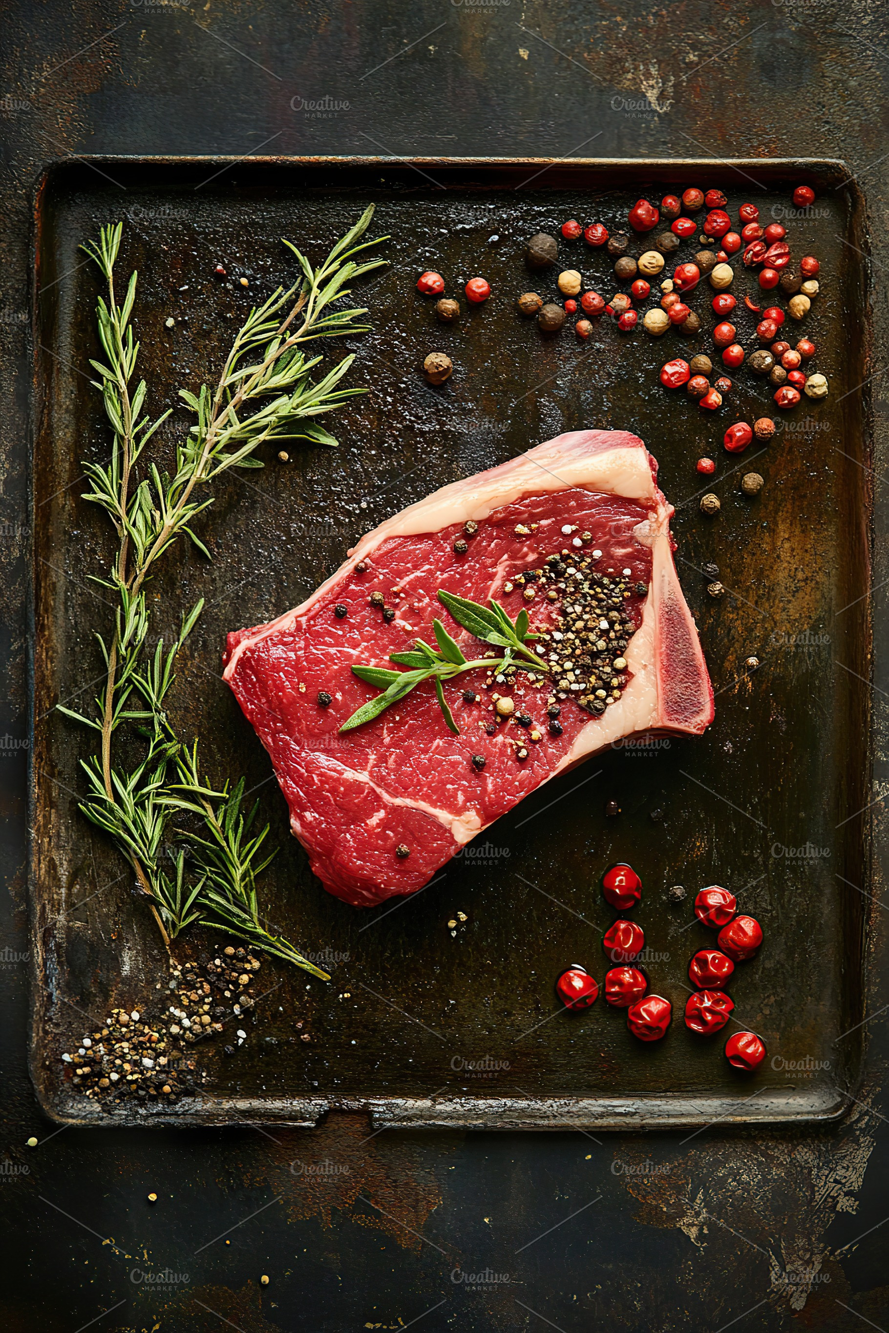 Grilling steak with fresh herbs and colorful spices in a rustic kitchen setting, a Food & Drink Photo by AlyaAnd