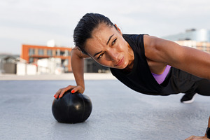 Young woman doing intense strength, a Sports & Recreation Photo by Artem Varnitsin