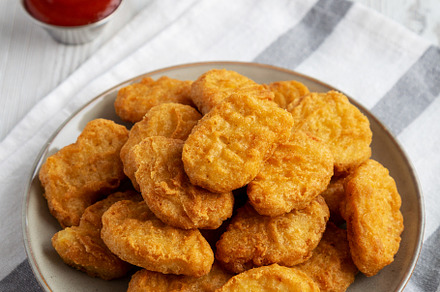 Homemade Chicken Nuggets with Ketchup, side view., a Food & Drink Photo by LiudmylaChuhunova
