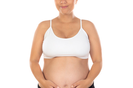 Image of pregnant woman touching her belly with hands, a Person Photo by José Manuel Gelpi