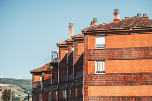 Brick apartment with wind turbines, an Architecture Photo by SkyNext