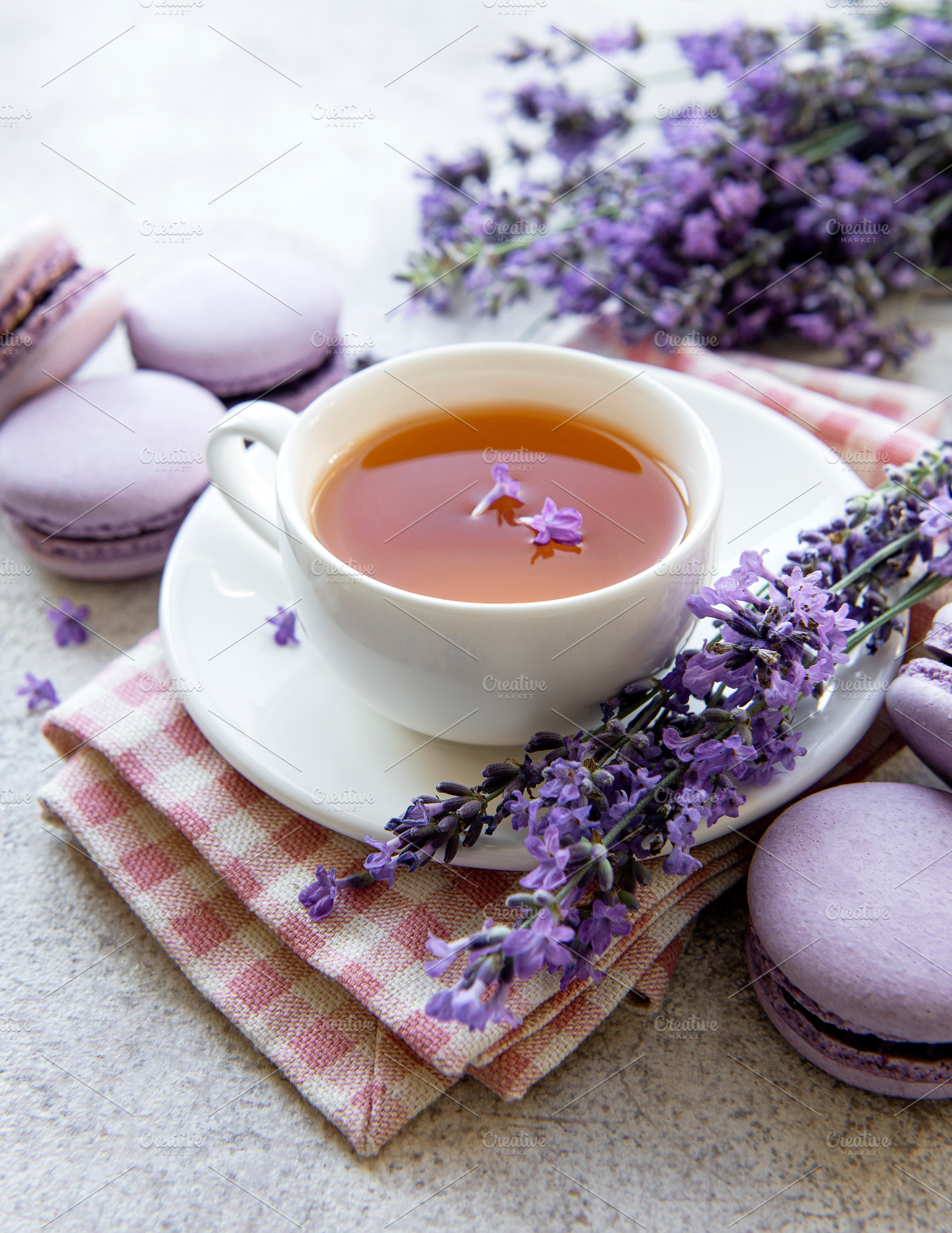 Cup of tea with macaroon dessert with lavender flavor, a Food & Drink Photo by Olena Rudo