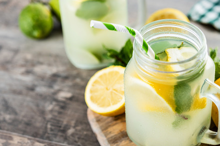 Lemonade drink in a jar glass and ingredients on wooden table, a Food & Drink Photo by etorres69