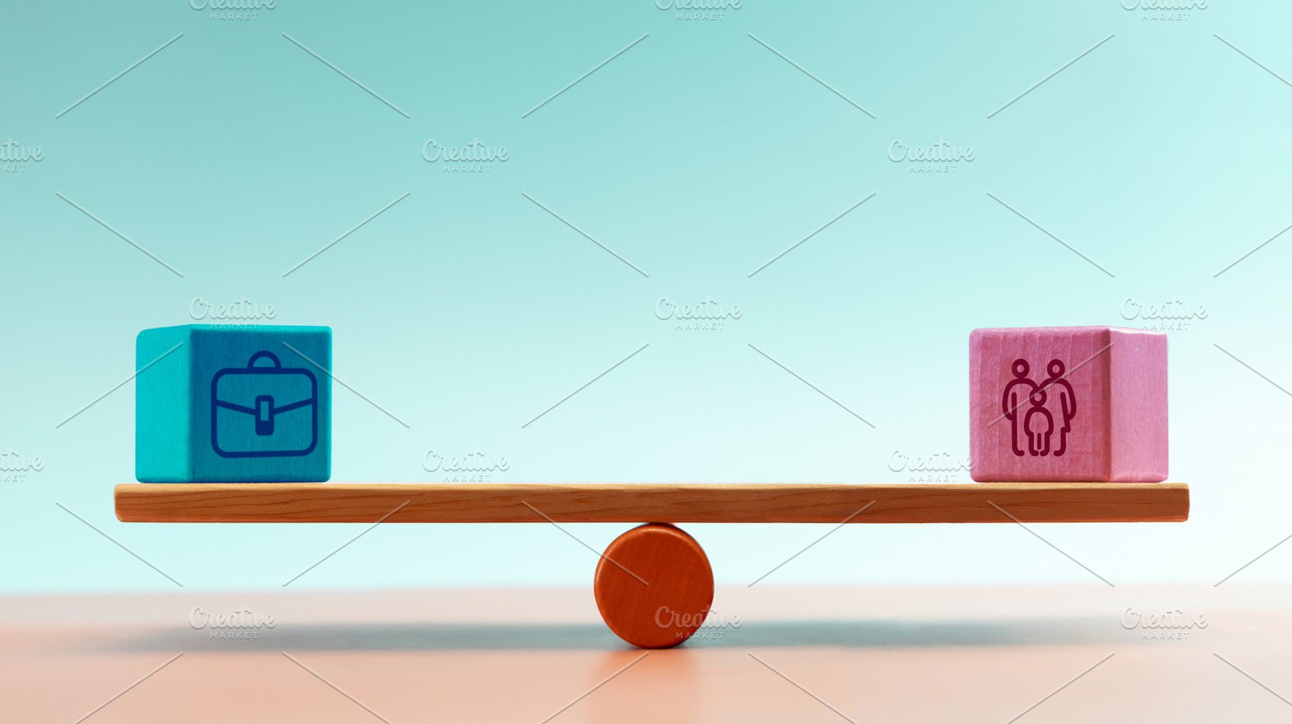 Blocks with work and family icons balanced on seesaw, symbolizin, a Photo by salmon.black