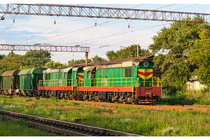 Two shunters with freight train at a station, a Transportation Photo by Leonid Andronov