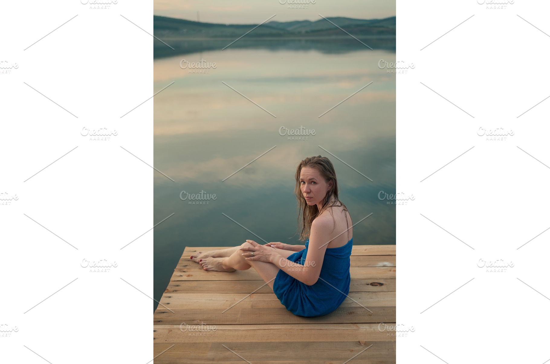 Woman in Blue Towel Sitting on Dock, a Person Photo by Jan Jack Russo Media