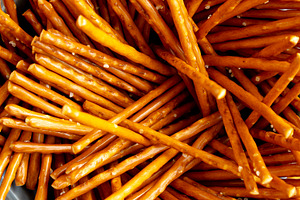 Organic Salty Pretzel Sticks in a Bowl, top view., a Food & Drink Photo by LiudmylaChuhunova