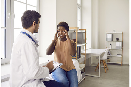 Male doctor consult black woman with, a Health & Medical Photo by StudioRomantic