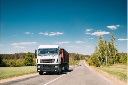 Truck In Motion On Country Road, a Transportation Photo by Our Amazing World