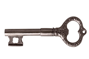 Old-fashioned silver skeleton key with ornate details, isolated, an Abstract Photo by Ales Munt