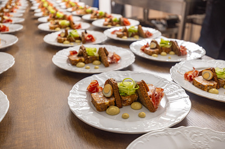 Multiple plates of beautifully presented food, a Photo by Grafvision photography